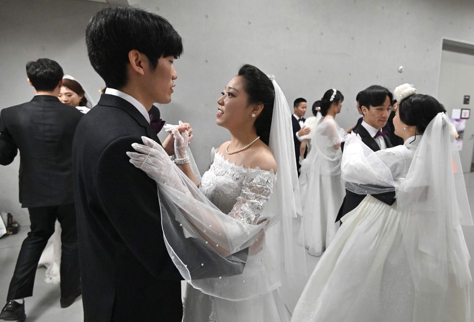 Couples prepare for their performances at a mass wedding ceremony organised by the Unification Church in Gapyeong.